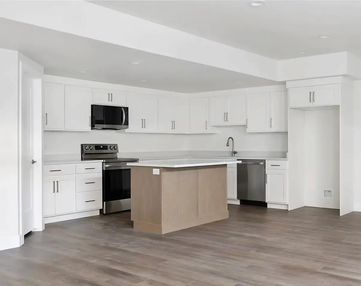 White Shaker Kitchen Renovation with Natural Wood Island and Quartz Countertops